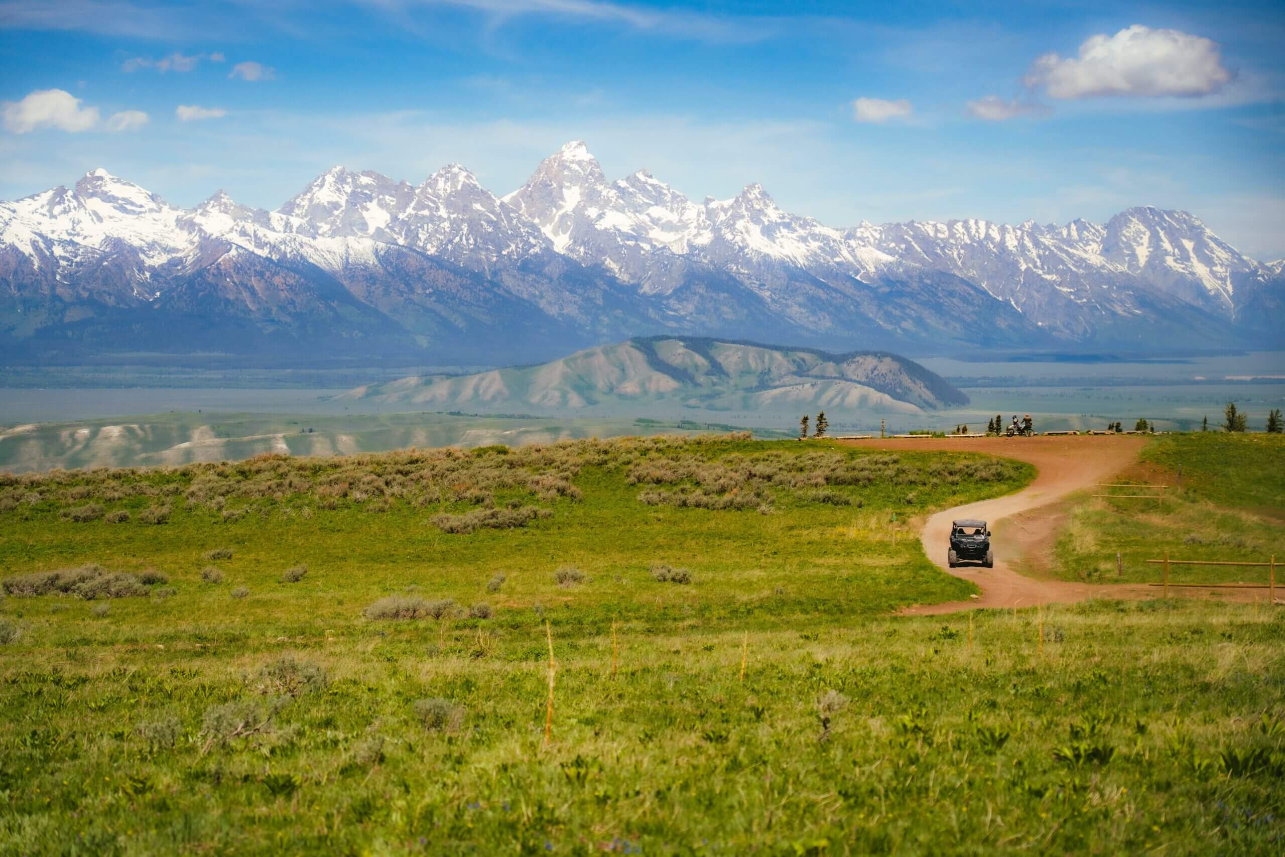 Side by side on the trail with a view of Grand Teton